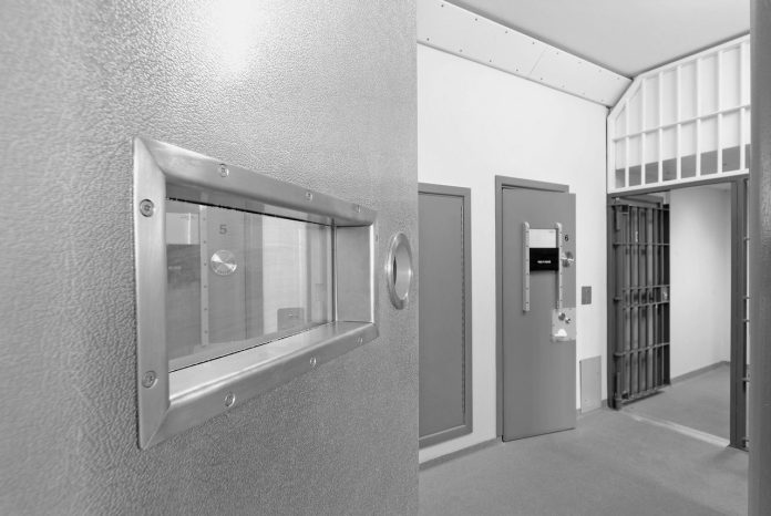 Interior view of a modern prison with open doors